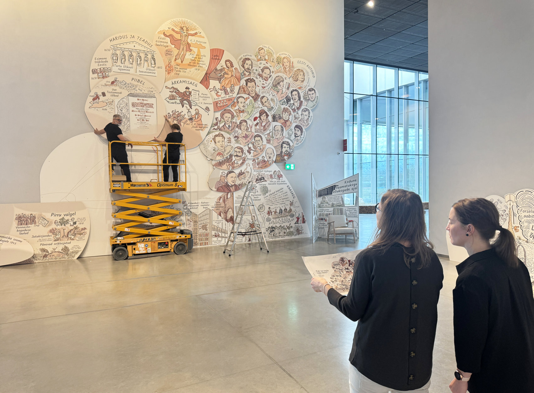 Eesti raamatu aastale pühendatud pannoo "Kas sa seda lugu tead?" ülespanek Eesti Rahva Muuseumis. Kunstnik: Siiri Taimla-Rannala. Foto: Tanel Rannala Eesti raamatu aastale pühendatud pannoo "Kas sa seda lugu tead?" ülespanek Eesti Rahva Muuseumis. Kunstnik: Siiri Taimla-Rannala. Foto: Tanel Rannala